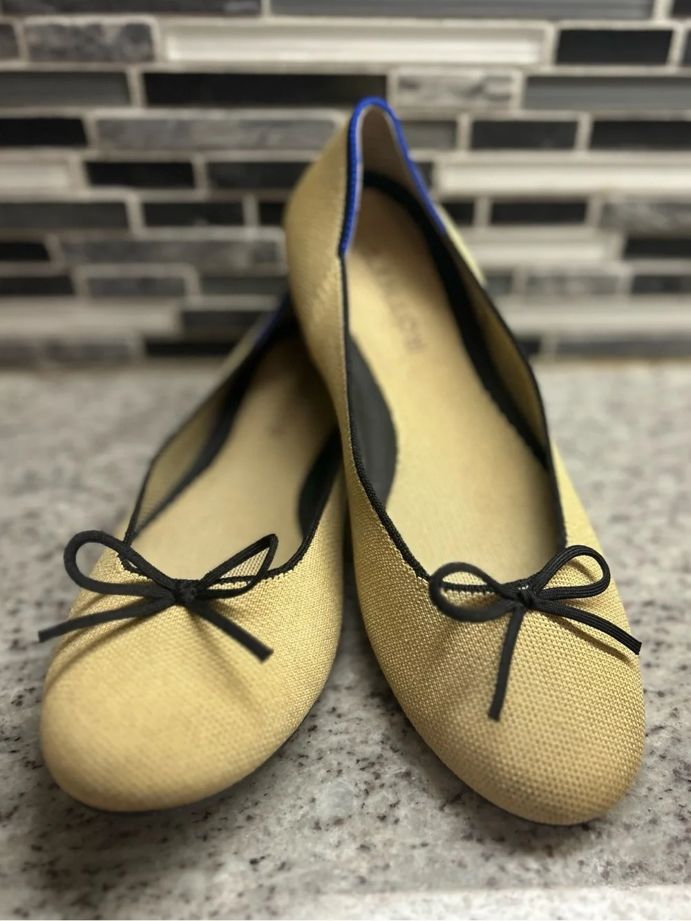 Rothy's Tan/cream Ballet Flats with Black Bow Trim and Blue Piping size 8